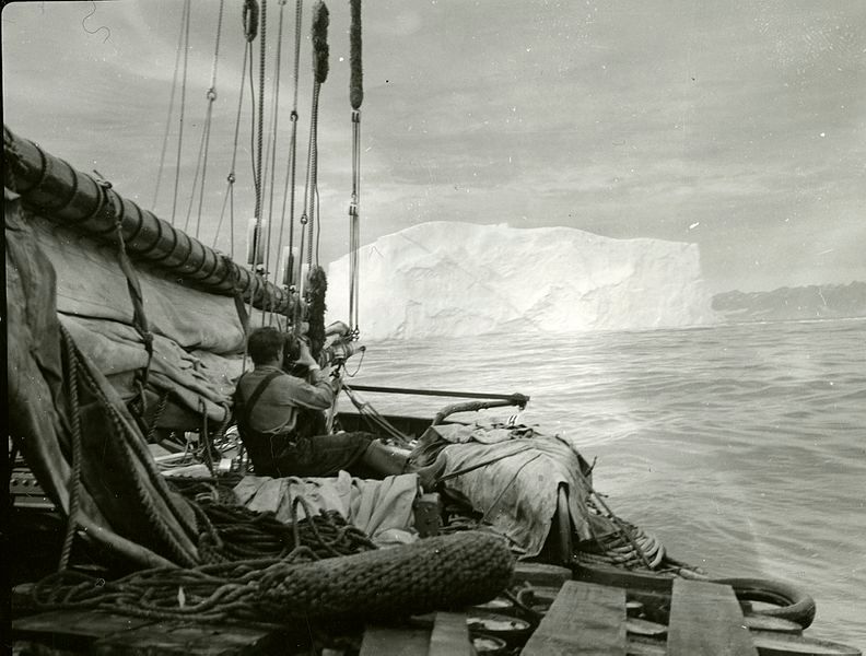 No._47._Crew_member_taking_a_movie_of_ice_berg_from_the_ship,_Greenland,_1939_(6351080300).jpg